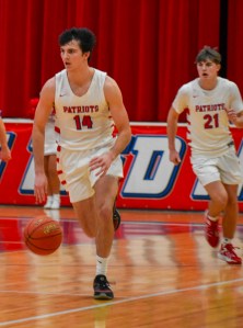 Lincoln County’s Sawyer Robbins pushes the ball up the court during the Patriots’ double-overtime victory against Pulaski County on Feb. 12. Robbins sealed the 64-62 win with a game-winning layup at the buzzer. (Photo by Casey Roberts)