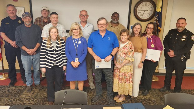 Lincoln County CASA volunteers are presented with President's Volunteer Service Awards during the March 13 Stanford City Council meeting. From left are Stanford Fire Chief Scott Maples, Councilmember Jason Hignite, Councilmember Eddie Carter, Councilmember Joe Tackett, CASA Executive Director Melynda Jamison, Lincoln County Family Court Judge Jane Venters, Stanford Mayor Dalton Miller, CASA Volunteer Terry Huffman, Councilmember Jerry Wilkinson, CASA Volunteer Susan Maupin, CASA Volunteer Manager Jennifer Lamb, CASA Volunteer Priscilla Miller and Stanford Police Chief Zach Middleton. (Photo submitted)