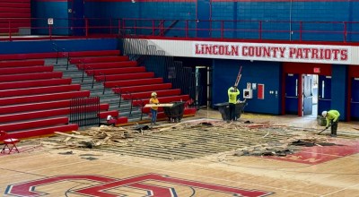Construction crews begin removing the original gym floor at Lincoln County High School, which has served the district for nearly 50 years. The replacement is part of a larger renovation project that includes new bleachers, lighting, and facility upgrades throughout the building. (Photo submitted)