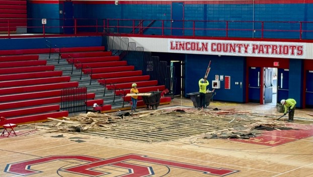 Construction crews begin removing the original gym floor at Lincoln County High School, which has served the district for nearly 50 years. The replacement is part of a larger renovation project that includes new bleachers, lighting, and facility upgrades throughout the building. (Photo submitted)