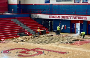 Construction crews begin removing the original gym floor at Lincoln County High School, which has served the district for nearly 50 years. The replacement is part of a larger renovation project that includes new bleachers, lighting, and facility upgrades throughout the building. (Photo submitted)